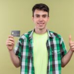 boy hold credit card in his hand