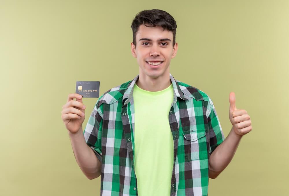 boy hold credit card in his hand