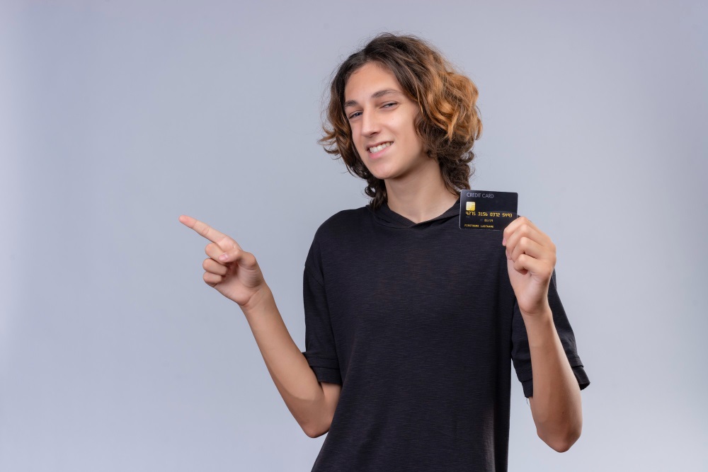 boy smiling and black color credit card