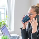 girl drink coffee and hold mobile