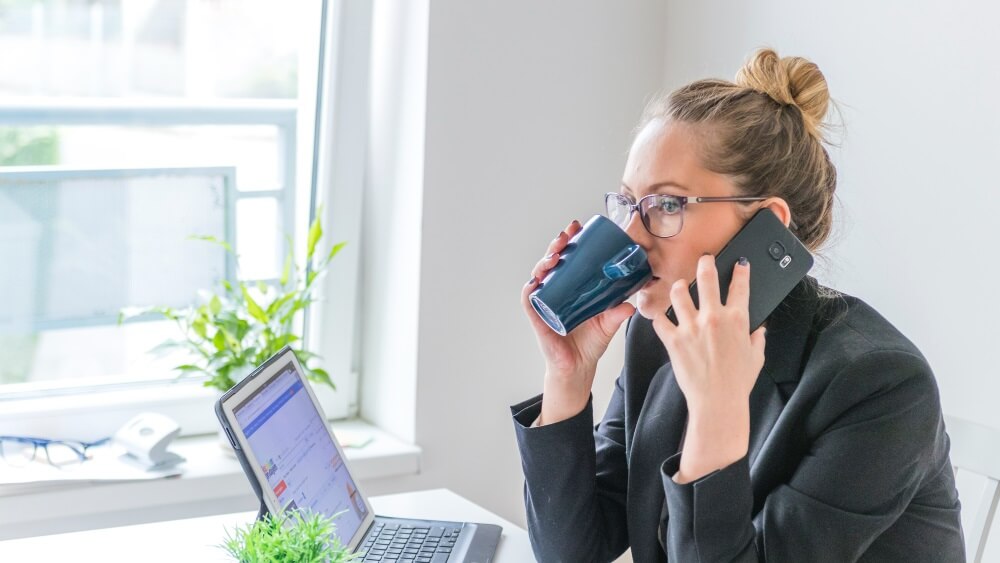 girl drink coffee and hold mobile