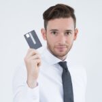 person hold credit card in hand